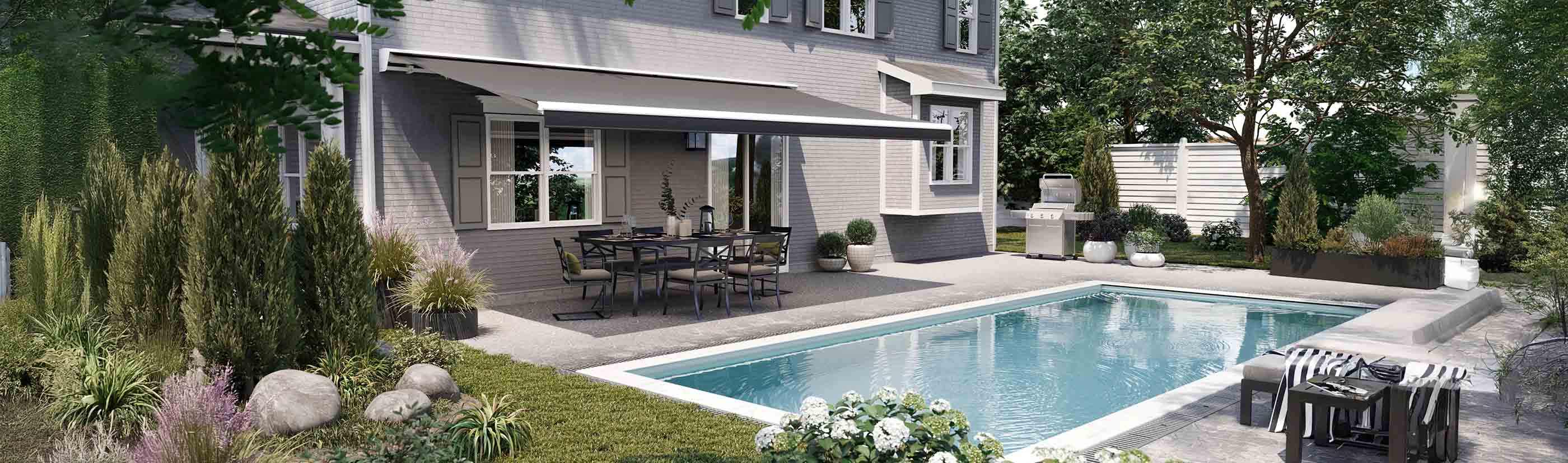 dark gray awning covering a patio with a dining table and chairs and a poolside view